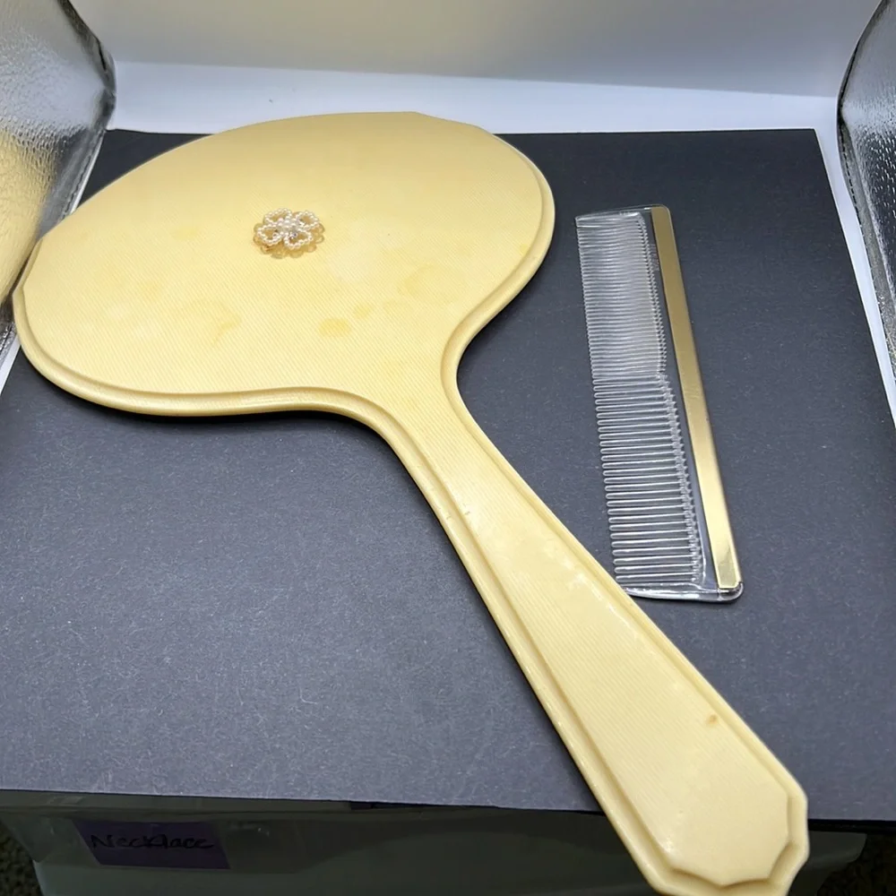 French Ivory 1950’s celluloid hand mirror and comb set